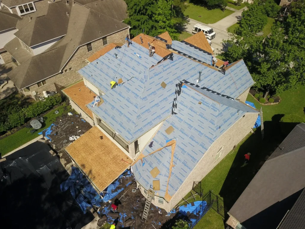 local-roofing-contractor-the-woodlands-tx roof being replaced
