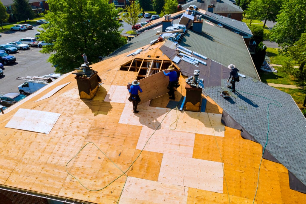 Replace old asphalt bitumen shingles on a house roof in order to repair roof
